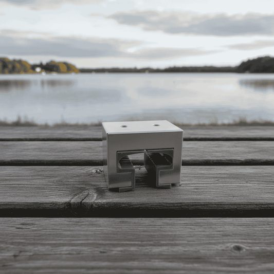 Metal bracket on a wooden surface with a lake and sky in the background